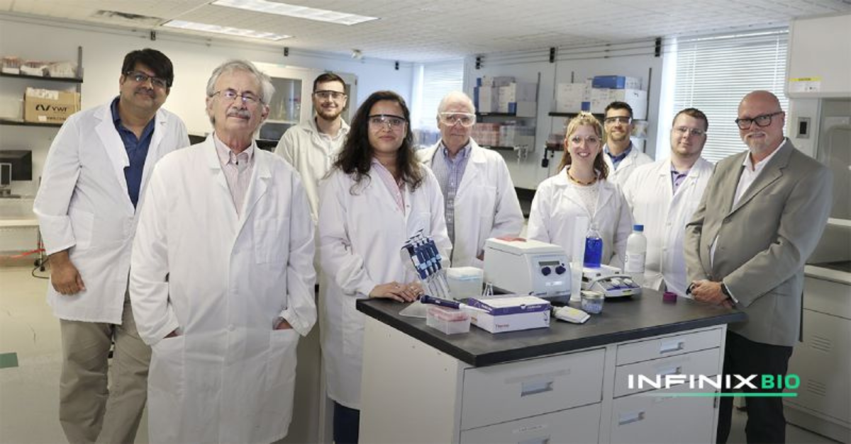 The InfinixBio team stood together in a lab