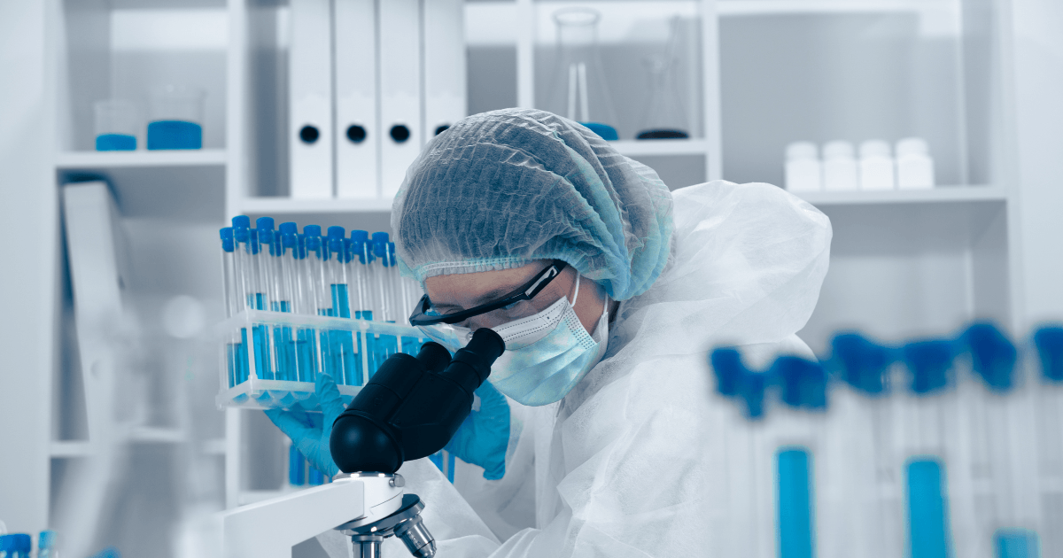 A scientist observing through a microscope